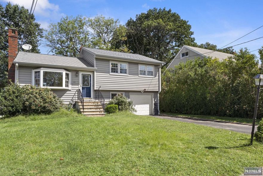 This won't last! Move right in to this nicely updated Split-Level home located at the end of a Cul-De-Sac! This home is Worry-Free! New siding in 2016, new Central A/C & Heat in 2018, new hot water heater in 2020! Open floor plan as you walk into the living room with a wood burning fireplace, dining room & kitchen. Upper level has 3 spacious bedrooms & full bathroom. Lower level has a family room, 1/2 bath, exit to yard & garage & leads to finished basement. Home sits on a large lot with manicured fenced-in yard & patio great for entertaining! Close to multiple train stations & major highways! SOLD AS-IS!