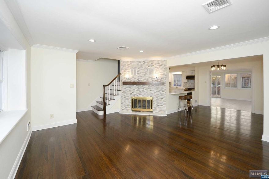 REMARKABLE FULLY RENOVATED EXPANDED RANCH STYLE HOME SHOWCASING 3 BEDROOM, WITH A POSSIBLE 4TH BEDROOM OR OFFICE SPACE, AND 2 FULL BATHROOMS. UPON ENTERING THIS MAGNIFICENT HOME YOU ARE GREETED BY HARDWOOD FLOORING LEADING YOU INTO THE LIVING ROOM FEATURING A STONE FACED WOOD BURNING FIREPLACE, DINING ROOM, A BEAUTIFULLY UPDATED MODERN EAT IN KITCHEN FEATURING STAINLESS STEEL APPLIANCES AND A PENINSULA WITH BAR SEATING, FRENCH DOORS USHERING YOU INTO THE FAMILY ROOM/ SUN ROOM LEADING YOU TO THE FULLY FENCED BACKYARD SHOWCASING A WOOD DECK AND VINYL POOL. THE FIRST FLOOR CONTINUES 2 BEDROOMS, A FULL BATHROOM AND OFFICE/BEDROOM SPACE WITH ATTACHED DEN. THE SECOND FLOOR SHOWCASES AN AMPLE SIZED BEDROOM. THE BASEMENT OF THIS HOME IS FULLY FINISHED FEATURING A REC ROOM, FULL BATHROOM, LAUNDRY ROOM AND UTILITY ROOM. HOME IS CONVENIENTLY LOCATED NEAR MAJOR TRANSPORTATION, RESTAURANTS, SHOPPING CENTERS, SCHOOLS AND MUCH MORE!