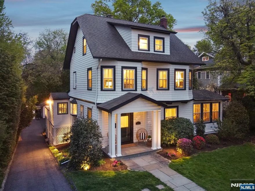 The Charm You Want, the Updates You Need and a Backyard You Didn't Think You'd Find. Welcome to 103 Highland Avenue. This classic 1910 side hall colonial with modern, move-in-ready updates is a true find in desirable Glen Ridge with its top-rated school system and easy access to NYC. The extra-large living rm with wood burning fireplace and adjacent formal dining rm set the stage for a warm, happy home that's meant for gathering. French doors lead to a separate, cozy family room with 2nd fireplace. The custom designed kitchen offers designer finishes + Wolf and SubZero appliances, island with breakfast bar, quartz countertops, wet bar and dining area with glass doors that open to the backyard deck. Upstairs has 3 bedrms including the primary suite with a spacious walk-in closet and luxurious updated bath with double sink vanity, radiant floor heat, Kohler finishings and jetted soaking tub. Renovated hall bath w 1 of 2 laundry centers. The 3rd floor awaits with 3 more bedrms and full bath. In the walkout basement: media/play room with surround sound, half bath, 2nd laundry room and workshop. Set on an exceptional 0.47 acre lot with a large deck overlooking the private, expansive backyard - this property is truly a standout. PLUS: 2-zone central air, built-in WiFi, house water filter & softener, generator hookup, sprinkler systm. All just blocks from GR's top-rated schools, NYC transit and neighborhood faves (hello Nicolo's & Fitz's!) This special home is not to be missed!