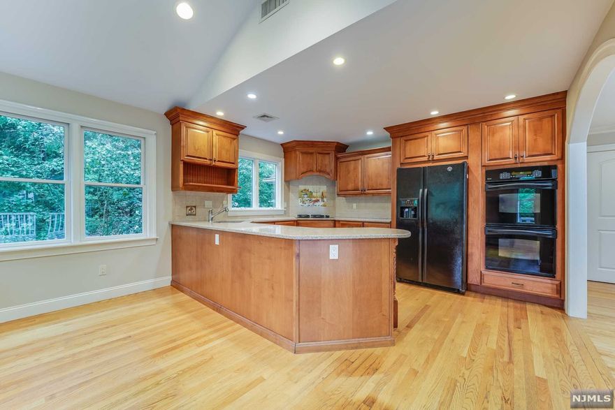 Updated, meticulously maintained and beautifully decorated 4 bedroom, 3 bath home with one car attached garage. First floor features: Entry foyer, large living room with gas fireplace, Dining room, gorgeous renovated kitchen with maple cabinets, granite tops peninsula, SS Appliances, and Eat In Kitchen. Full bathroom and access to large, fenced in backyard complete this level. The second floor includes 4 Bedrooms and 2 Full Baths, and access to the attic. Finished basement with laundry, plenty of storage and utilities. Hardwood floors throughout, Central Air and Heat. Blue Ribbon Schools, close to shops and public transportation.