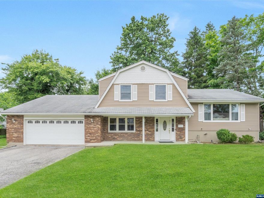 SPACIOUS & EXPANDED 4 BEDROOM SPLIT LEVEL: featuring an updated kitchen, ground floor bedroom suite, and contemporary open concept, 1 Blanche Avenue will meet the requirements of today's buyer. The 1st floor is an open plan with updated kitchen that opens up to a deck, and a large living room & dining room combination. The 2nd floor has 3 bedrooms including a primary bedroom with a very large walk-in closet, and separate access to the hall bath. The ground floor is expansive with 2 family rooms, full shower bath, laundry, and bedroom suite with a half bath. Don't miss this excellent opportunity to live in desirable Demarest NJ--award winning schools, close to NYC, multi-zone heat and central AC, 2 car garage, beautiful 100x126 lot--make it yours!