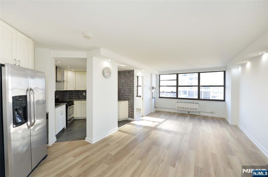 Step into refined living in this exquisitely renovated 2-bedroom, 2-bath residence offering 979 sq ft of sophisticated comfort and breathtaking, unobstructed views of NYC Midtown, Uptown, and the George Washington Bridge. An expansive open-concept layout showcases sleek modern finishes, hardwood and tile flooring throughout, and a spacious primary suite with a spa-like ensuite. Walls of windows invite spectacular sunrises to pour into the home, bathing the living space in natural light and warmth from morning to night. Located within the iconic and highly coveted Galaxy Towers, residents enjoy a truly resort-style lifestyle where luxury and convenience are seamlessly woven into everyday living. Amenities include ALL utilities, 24-hour concierge and security, indoor and outdoor pools, hot tubs, an exclusive spa, and a state-of-the-art fitness center with high-end equipment and saunas. Additional offerings include tennis and pickleball courts, beautifully landscaped outdoor spaces, conference rooms, childrenâ€™s play areas, and more. Perfectly positioned with effortless access to NYC and all major commuting options, this premier location is also moments from James J. Braddock North Hudson County Park and North Hudson Dog Park. The Galaxy is pet-friendly and welcomes up to two pets because luxury living should include every member of your household.