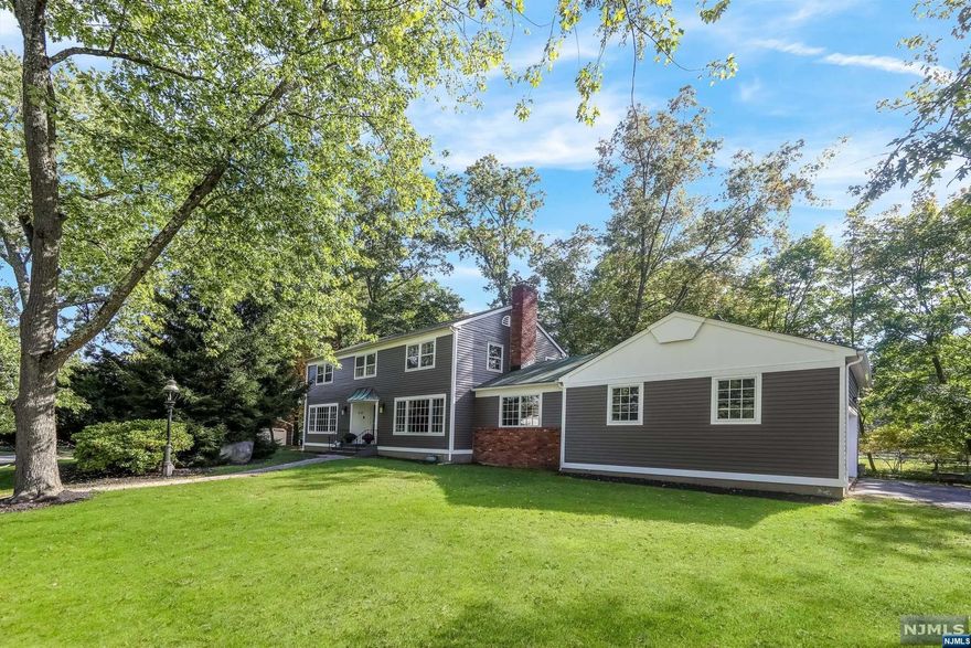 Come see this center hall colonial located in the most desirable part of Harrington Park situated on almost 1/2 an acre of flat property on a quiet cul-de-sac! Boasting over 3000 sq feet of living space, walk right into the spacious open foyer which leads to your large living and dining room. Enjoy the large family room with a fireplace and direct access to the deck/backyard with the sliding glass doors. First floor also has a powder room and laundry right off the eat in kitchen. Basement is fully finished with a rec. room, gym, office and tons of storage. This home also features a large 2 car heated garage. Schedule your private showing today! Owner has NJ Real Estate License