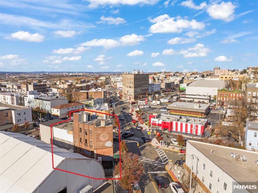 Dynamic location in the center of downtown Union City on a corner lot and with incredible vantage points. At the intersection of Paterson Plank Rd., Summit Ave. & a short block from both Secaucus Rd. & Kennedy Blvd. = extremely high visibility. Possible great location for a National Brand name commercial tenant! These two buildings are approx. 90" Feet of street front with two store spaces and four apartments above. Great sunlight into the apartments w/some views of NYC skyline from the top floor. This is an active construction project. Current plans include 4 apartments over two commercial/retail spaces for a total of 7,456 square feet (keeping the brick walls and replacing everything else).