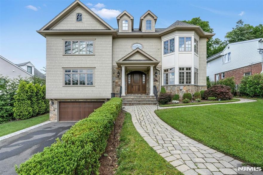 Custom built 9 bedrooms, 8.5 bath Center Hall colonial in upscale location.10 ft ceilings on first floor, Banquet sized Formal Dining Room with elegant washing station. Substantial kitchen with top of the line appliances adjacent to coffered ceiling Family Room, French doors lead into custom built library. Grand staircase leads to ensuite bedrooms. Private 190 ft deep private property.