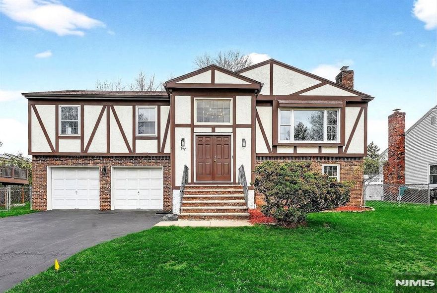 Nestled on a quiet cul-de-sac in the highly sought-after town of River Edge, this impeccably maintained 4BR/3BA home offers comfort, privacy, and move-in-ready appeal in a neighborhood where beautifully maintained homes reflect pride of ownership & thoughtfully designed new construction complements the community's charm. Freshly painted throughout & ft. refinished red oak floors, the home feels warm & cohesive, from the welcoming 2-story foyer to its bright, open living spaces. An oversized bay window fills the home w/natural light & overlooks the peaceful, tree-lined street. The kitchen showcases quartz countertops & stainless steel appliances, providing a clean modern workspace for everyday cooking & effortless entertaining. Each bathroom carries the same timeless design with matching quartz finishes. The spacious primary suite includes a walk-in closet and updated bath, while the additional bedrooms are well appointed and inviting. The lower level adds flexible living space w/ a large rec room, 4th BR & full bath -- ideal for guests, extended family or a home office. The level lot offers peace of mind, free from creeks, power lines or easements. Thoughtfully updated & truly move-in ready, this home is close to River Edge's top-rated schools, parks, shopping, dining and a short distance to both NYC train and express buses -- all in a quiet setting that offers privacy, a strong sense of community and lasting comfort. Fireplace/chimney/appliances as-is; no known issues.