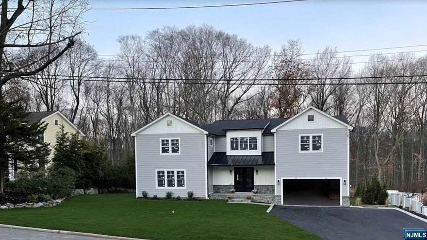 Spectacular new Craftsman Colonial dream home featuring over 6000 sq. ft. including 6 bedrooms and 6 bathrooms with Hardie Plank siding, Azek board & batten, Nantucket blue stone exterior set on a private half acre with the rear yard facing a breath taking wooded park. The charming front porch is covered by a standing seam roof. The main level boasts a 2 story foyer with motorized chandelier, 2 story great room that features a gas fireplace, wet bar, floor to ceiling views. The Chef inspired kitchen is complete with quartz countertops, Wolf & Sub-Zero appliances, center island and dining area. Also a FDR, FB, guest en-suite, pantry, mudroom and access to a 2 car garage. The 2nd fl features 4 Bedrooms including a primary suite with spa like bathroom and 2 WIC'S, Jr. en-suite, 2 BR's with Jack & Jill bathroom and laundry. Ground level walk out offers a Rec Rm, Home Theater Rm, FB, BR. HDWD floors, 5 zone HVAC, Anderson windows and sliders, Crown moldings,Coffered ceilings