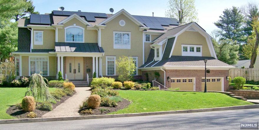 Fabulous Colonial Home On The East Hill of Tenafly, Total Living Space Incl. Basement Over 5000 SF. With Top Of The Line Materials and Craftsmanship. Gorgeous Bright Home on A Flat Property. 2 Story Entry Foyer, Formal Living and Dining Rooms ,Butler Pantry, Family Rm W/FPL, 1/2 Bath, Kitchen And Breakfast Area Are Bathed In Natural Light That Has Access To A Paver Patio With Lovely Fenced In Backyard. 2 Staircases, Laundry Rm On 2nd Floor, Master Bedroom W/FPL, Beautiful MBTH W/ Jacuzzi Tub+ Separate Shower, Ensuite Bedroom W/FBTH, 2 More Bedrooms Plus Full Bath. High Ceilings throughout. Hardwood Floors and Elaborate Moldings throughout The House. Security System, Central Vacuum, Full Finished BSMNT INCL A Legal Bedroom, FBTH, Recreation/Gym/Office Area. Full house Gas Generator, Solar Ownership. 1 Block From NY Bus, Close To Elementary School. Owner has NJ real estate license.