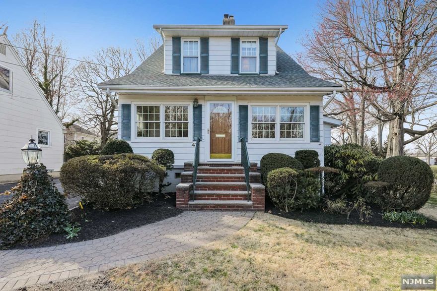 Welcome to this wonderful 2400+ sq ft home located on a cul de sac with direct access to the lovely Nichols Park. The first floor offers sun drenched space including a welcoming sun porch, formal living room, dining room that opens to an updated eat in kitchen with access to the rear yard patio. In addition, there is an oversized family room for large gatherings or step into the tranquil den overlooking nature's oasis of Nichols Park. Upstairs there is 3/4 bedrooms, a full bath & plenty of large closets. The basement level is mostly finished with 2 rec rooms for fun entertainment, a workroom, laundry and a convenient half bath with access to the backyard. Ready for summer entertainment with a covered patio, double garage and level private yard. NYC transportation a block away, stores, & schools ideally located