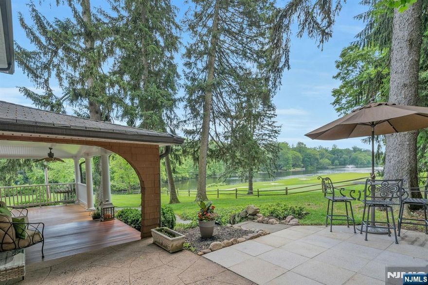 Golferâ€™s Dream! This must-see gem is ON the golf course and Crystal Spring Lake, blending timeless architectural charm with modern luxury. Expansive decks showcase breathtaking lake and fairway views, creating the perfect backdrop for entertaining. Enjoy alfresco dining with your pizza oven, year-round covered porch living, unwind in the hot tub or by the fire pit, or launch a kayak or boat or fish from your private dockâ€”one of only a few in this exclusive 550-home community. Inside, a renovated kitchen and elegant dining room both overlook the course, while the gracious living room invites you to cozy up by the fireplace. The main level features a tranquil primary suite with marble bath and sliders to a private garden, plus an office and spacious family room. The lower level offers a mahogany bar, Sub-Zero refrigeration, 2nd laundry, shuffleboard/billiards, gym area, and heated, saltwater pool with commercial dehumidification system. Heated performance garage. A private apartment with its own entrance and deck is ideal for guests, au pair or rental income. Residents of Ramsey Golf & Country Club enjoy a private 18-hole course, lakefront pool and beach, paddle tennis, pickleball, dining, social events, and one of the areaâ€™s best junior golf programs. Vibrant town, award-winning Farmer's Market, top-rated schools and restaurants and NYC transit nearby. A once-in-a-lifetime chance to experience the serenity and privilege of true clubside living! Seller has NJREL.