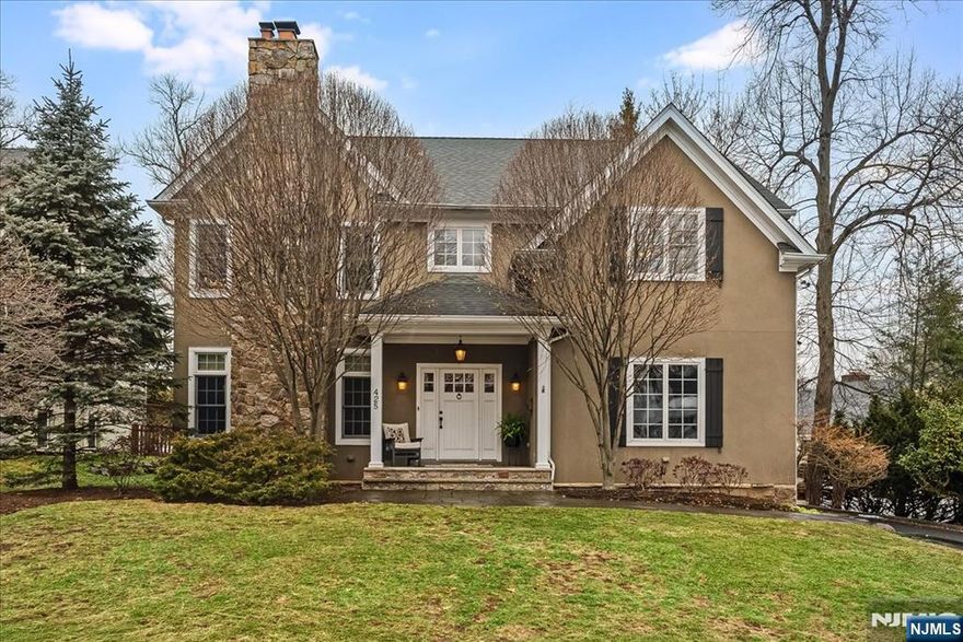 Discover the timeless beauty & modern comforts in this 20 year young stately colonial. Unbeatable location just steps from NYC trains/buses, top rated Glen Rock schools and its quaint & charming downtown. This custom 4+/4 bath home offers over 3,300 square feet of refined space. A welcoming front porch invites into the entry foyer, flanked by the elegant banquet sized dining room w/gas fireplace and the sophisticated & chic living room. Step thru to the expansive chef's kitchen, featuring top-rated appliances, custom cabinets & pretty countertops, offering both center island seating & a breakfast area for casual dining. This dream kitchen flows perfectly into a cozy family room featuring beautiful built-ins around a striking wood burning stone fireplace... glass sliders open to a gorgeous stone patio, amazing outdoor kitchen, lounge area & private landscaped backyard oasis. A convenient mudroom, laundry and powder room complete the 1st floor. Upstairs find the luxurious primary suite w/vaulted ceiling, dual walk-in closets & a spa like en-suite. Three additional expansive bedrooms & full bath finish the 2nd floor. The recently completed generous lower level offers so much additional living space. Prepare to be dazzled with this fantastic renovation offering an oversized entertainment/lounge area w/projection screen, a full bar, an essential home gym or potential guest room/home office, powder room, closet space, storage room & utilities. Welcome home to 425 Rock Road!