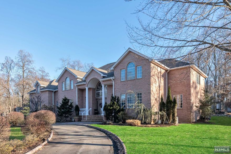 Elegant all brick custom center hall Colonial set back on almost one-acre of landscaped property in desirable Allendale. A circular driveway leads you in to a Grande two-story entrance w/ double bridal staircase & marble floors. Short distance from all 3 highly ranked schools. over 6,500 sqft of thoughtful quality interior. Custom designed kitchen with granite countertops, center island leads to an intimate breakfast area w/grand windows. Elegant entry welcomes you to bright & spacious formal living, family room, & formal dining room. One bedroom and 2 full baths complete the first level. On the second level you will find the primary suite with sitting area, office, and luxurious bathrm, Three generous BRS w/ 2 FBTHs complete this level. Fully finished basement with summer kitchen, rec room, movie theater, home gym, one bedrm,full Bath, and wine cellar. Walkout doors lead to large patio park like backyard perfect for outdoor entertainment. Close to NYC transportation. A must