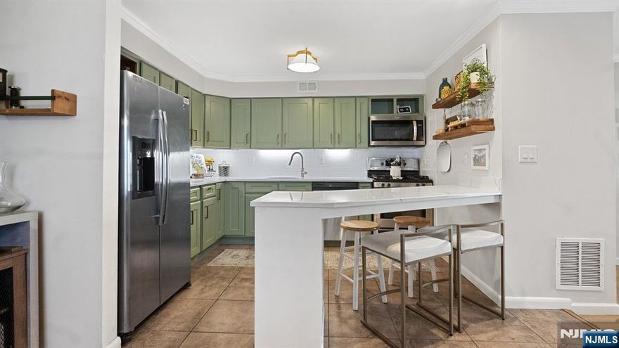 Welcome Home! Discover this beautifully updated 2-bedroom, 2-bathroom townhouse in the highly sought-after Carlton Hill, tucked away on a quiet cul-de-sac.The first floor boasts an open-concept layout featuring an eat-in kitchen w/ stainless steel appliances, dining area, and living room with a cozy wood-burning fireplace. Step through the sliding doors onto a peaceful balconyâ€”perfect for relaxing or entertaining. Hardwood floors run throughout this level, which also includes a bedroom and a full bathroom. Downstairs, youâ€™ll find a bright primary bedroom with a walk-in closet and en-suite bathroom. This level also offers convenient laundry and garage access, with a 1-car garage beautifully finished with epoxy flooring. Ideally located near downtown Rutherford shopping, American Dream Mall, Metlife Stadium, public transportation, schools, and parks, this home truly has it all. A must-see!