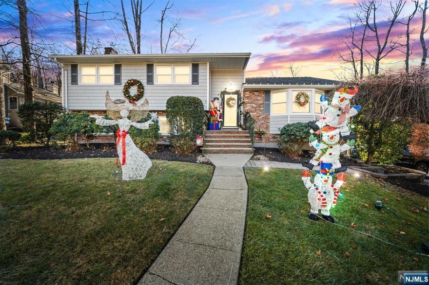 North Caldwell split level home located on expansive lot in quiet residential neighborhood may be your perfect holiday present. There is plenty of living space on all three levels of this home. Entry foyer leads to good sized living room with bay window overlooking front yard. Formal dining with sliders to backyard deck is great for entertaining. The adjacent eat in kitchen expands dining area. Second level has three bedrooms, recently renovated shared bathroom and a primary with walk in closet and updated bath. Ground level living has a large family room with plenty of windows and a gas fireplace. Fourth bedroom or office space is ideal for that work from home individual. Laundry room and access to oversized two car garage complete this level. Walk out to your backyard and feel like you are on vacation with deck, patio, large grass area and built in pool! This is your opportunity to own a home in a beautiful neighborhood with a highly ranked school system.
