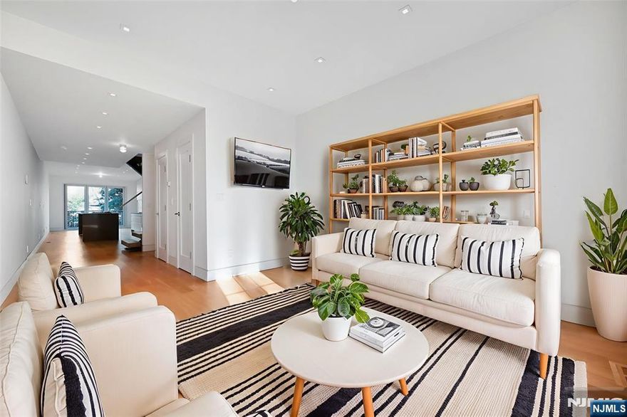 Rare Townhouse style rental with 3 car parking and terrific outdoor space in downtown Hoboken. This newly renovated home with natural sunlight throughout is designed with new plank wood flooring, floating custom staircase and a nano panel door leading to a beautiful IPE deck and landscaped yard offering the perfect blend of indoor and outdoor living. The open kitchen is a great space for entertaining with a spacious breakfast bar and separate dining area and offers a high end Thermador pro appliance package. Additional features include recessed and soffit lighting, Carerra marble baths with Kholer fixtures, full size GE Washer/Dryer, terrific closet space, gas fire pit and two Weber Grills. The spacious private 3 car garage is certainly a rare find. Don't miss this tremendous opportunity to live in a townhouse in downtown Hoboken with easy access to all Hoboken has to offer.