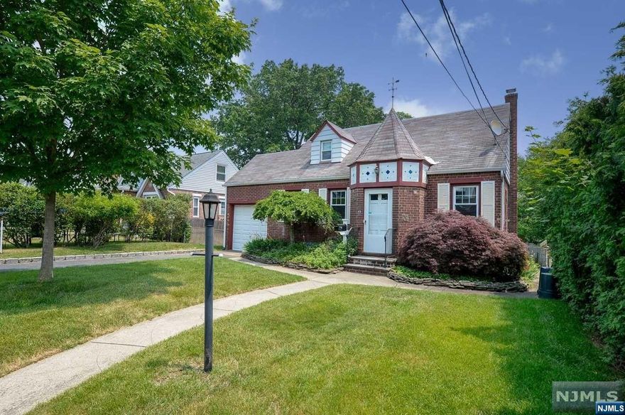 Picture perfect Cape Cod situated on one of Dumont's prettiest streets! This home is in immaculate condition and move in ready. Entry foyer opens to large living room with gleaming hardwood floors. Two nicely sized bedrooms. Updated full bathroom with gorgeous tile! Modern kitchen that opens to relaxing screened porch. Breakfast nook. Upstairs features 2 oversized bedrooms and a full bathroom with skylight. Beautifully finished basement with tile flooring and updated half bathroom. Fenced rear yard, gas hot water baseboard heat, central air, underground sprinklers, one car garage. A must see to appreciate! Owner has NJ RE license.