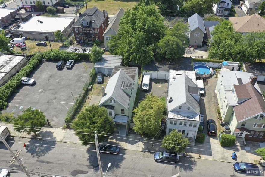 Great investment property for either a primary resident owner and/or for rental income. The first floor has 2 bedrooms, 1 office/den, 1 full bath, living room and EIK along with a ton of potential in the unfinished basement. Second floor has 3 bedrooms, 1 full bath, living room and EIK. Additionally, the walk-up finished attic has 2 bedrooms and 1 full bath with a little tlc house has so much to offer . Property will be delivered vacant as both units owner occupied! Conveniently located near S Orange Avenue this property offers a 50 x 100 lot with a 2-car garage and a driveway for plenty of parking. Come see for yourself!