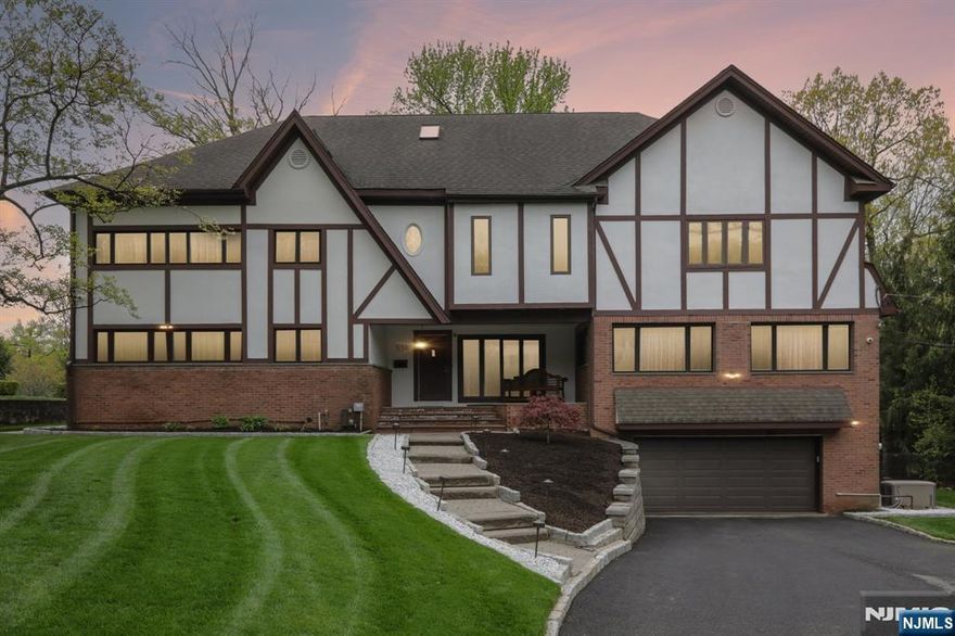Step into timeless elegance with this beautifully updated Colonial/Tudor-style home in sought-after Englewood. Blending classic charm with modern comforts, this 4-bedroom, 3 full bathroom residence is truly move-in ready and designed for both everyday living and effortless entertaining. The heart of the home features a stunning sunken living room, complete with a cozy gas fireplace and custom built-insâ€”an inviting space filled with warmth and character. The thoughtfully updated interior flows seamlessly, offering spacious rooms, abundant natural light, and large walk-in closets that provide exceptional storage throughout. The finished basement expands your living space with a stylish bar area, perfect for hosting gatherings or unwinding at the end of the day. Convenience is key with laundry rooms located both in the basement and on the bedroom level. Step outside to your private backyard retreat, where a large patio, professional landscaping, and ambient outdoor lighting create the perfect setting for relaxing evenings or entertaining under the stars. A generous grass yard offers plenty of room for recreation and play. Additional features include a security system for peace of mind and recent updates that ensure a turnkey experience for the next homeowner. A rare blend of character, comfort, and modern upgradesâ€”this is the home youâ€™ve been waiting for.