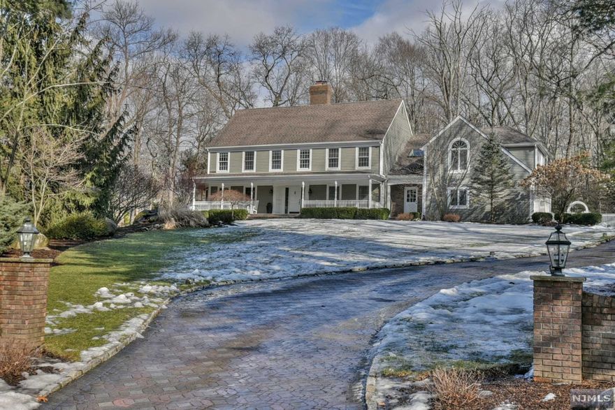 Nestled on a lush grassy bluff in the Fardale section of Mahwah is 9 Chapel Road. A winding paver driveway leads you to this stunning Colonial Manor where your memories will be lived with love. Kick back on the wrap-around front porch while sipping a glass of lemonade on a warm day. Welcome your loved guests in the formal front foyer & celebrate holidays & everyday in abundant living spaces that flow easily from room to room. Create culinary masterpieces in the modern eat-in-kitchen with beautiful backyard views while food & laughs are served up in your formal dining room. Gather for the big game or your favorite flick in the warm & bright Great Room. Secluded on 1 acre of professionally landscaped property & boasting a gorgeous backyard oasis with a multi-tiered oversized deck, inground pool, cabana & waterfall, this home is resort living at its best. Come make this spectacular home yours today before another buyer gets to the door!