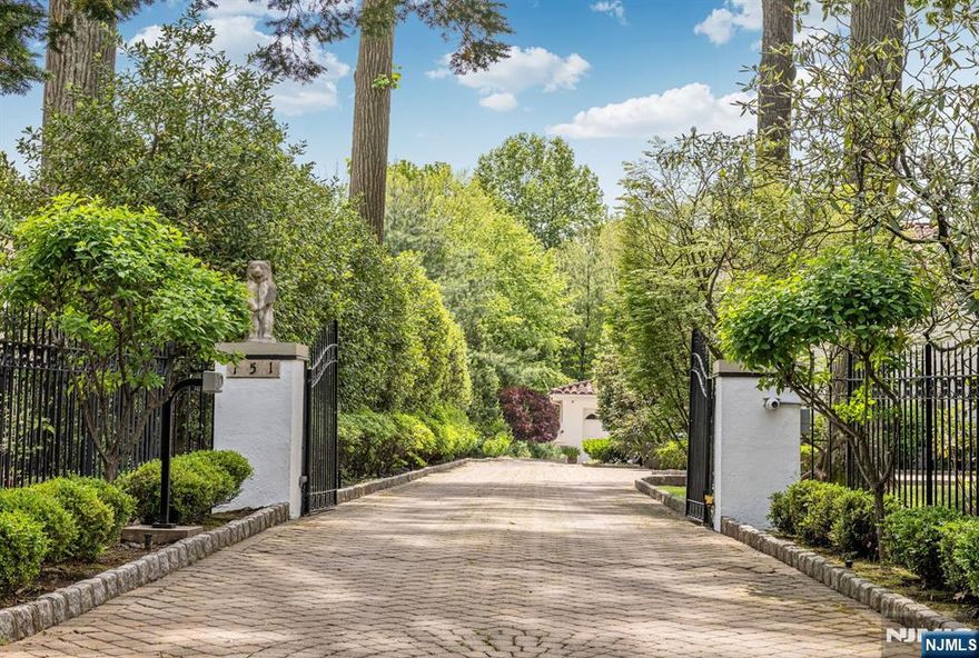 One of the most iconic Mediterranean Englewood East Hill mansions is now available. Originally purchased from the international Italian soccer superstar Giorgio Chinaglia, this 1924 villa, set on 1.33 acres of exquisitely landscaped property has been meticulously restored to its original grandeur. Amenities such as a pool, outdoor dining pavilion, and expansive dining and living rooms allow for both indoor/outdoor entertainment. The living space is composed of 8 bedrooms, 7 full baths and 2 half baths, with a guest wing having 2 bedrooms and a full bath, and basement gym with a full bathroom including a steam and sauna room. Having a location close to houses of worship, this estate offers a private European style experience nestled behind gates that welcome a unique family living opportunity. PLEASE VISIT THE VIRTUAL TOUR AND ALL THE PHOTOS