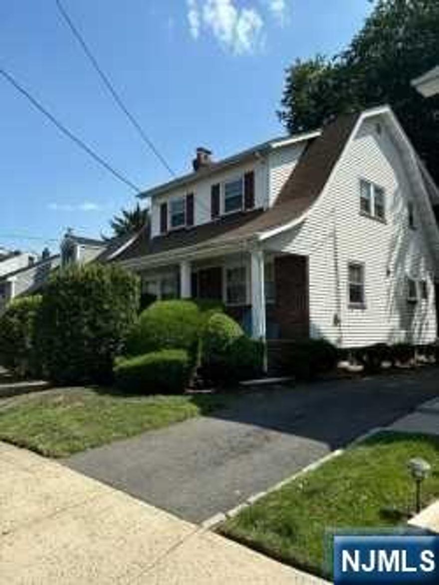 PRIME LOCATION!!! Very quiet block close to parkway, this home features all wood floors in beautiful shape/ kitchen floor is tiled, three bedrooms all with closets located on the second floor and one full bath. First floor offers living room with working wood burning fireplace that was barely used. Separate dining room and an eat in kitchen, also one full bath. enclosed backyard porch with attached outside deck. Very nice yard space and a detached two car garage. This home is in some need of TLC to make it your own. Seller makes no known issues but this home is being sold in a AS IS condition. THIS IS NOT A SHORT SALE ( buyer will be responsible for all inspections ( CO, fire, etc... )