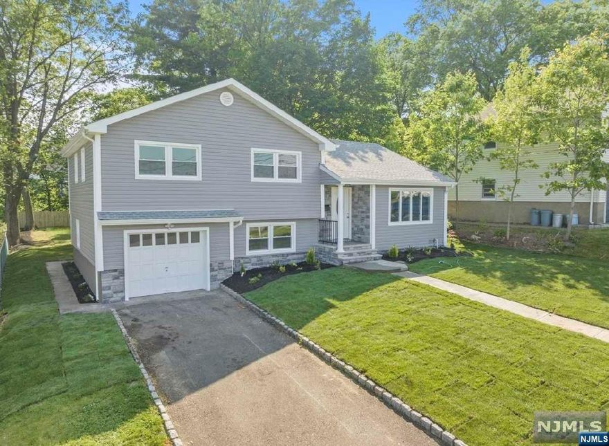 This beautiful house has recently undergone a stunning renovation, making it the perfect home for those seeking style, comfort, and convenience. Upon entering the house, you will be greeted by a spacious and open living area, complete with gleaming hardwood floors and large windows that fill the room with natural light. The kitchen has been completely updated with modern finishes and features high-end stainless steel appliances, custom cabinetry, and a large center island with plenty of counter space for cooking and entertaining. The adjacent dining area is perfect for family meals or dinner parties with friends. The primary bedroom is a luxurious retreat, featuring a spacious closet and an en-suite bathroom with a custom-tiled shower and modern fixtures. There are two additional bedrooms, each with ample closet space and large windows that offer plenty of natural light. The second full bathroom has been completely updated with new tile, fixtures, and a modern vanity.