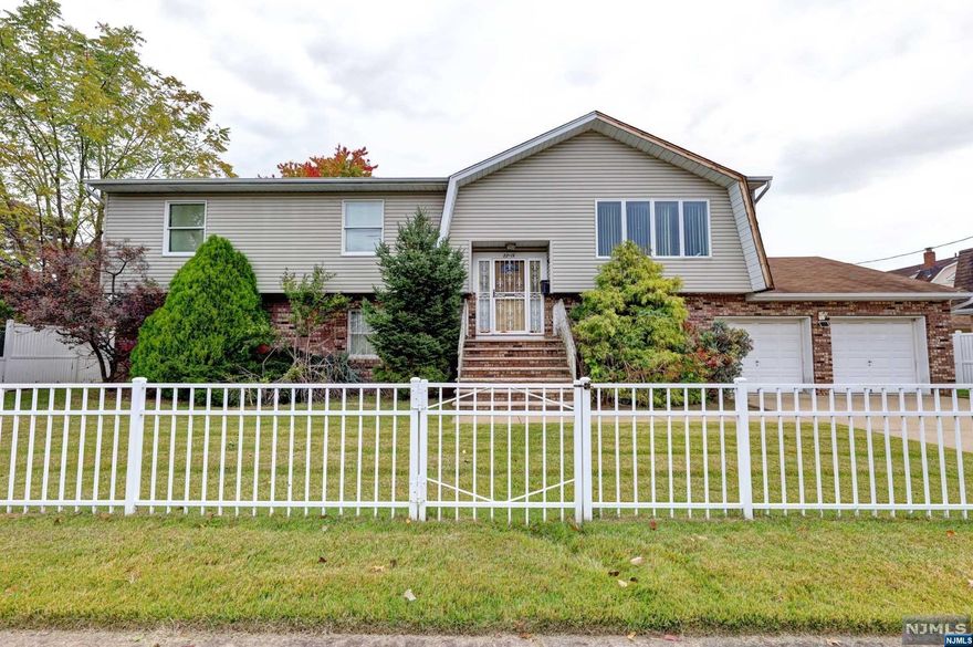 Calling all investors, contractors or end users .. ENORMOUS approx 3000 sqft B/L home w/PRIVATE EXTENDED FAMILY SUITE. First floor includes LR, DR, MEIK w/deck off rear, hallway bath, Bed, Bed, Primary Bed w/Full bath. Ground floor has huge family room w/entrance to 2 car attached garage with heat and storage area, half bath, laundry and mech rm. PRIVATE SUITE w/Separate Entrance has Lr, DA, MEIK, full bath, bedroom. HUGE LOT W/SHED, FULLY FENCED PROPERTY, 2 BRAND NEW BOILERS, 2 CENTRAL AIR UNITS, 2 WATER METERS, 2 HOT NEW WATER HEATERS and all wood floors under carpet. HOME NEEDS WORK, roll up your sleeves and bring this huge home back to life. HOME SOLD STRICKLY IN "AS-IS" CONDITION .. NO REPAIRS WILL BE MADE. HOME IS A SINGLE FAMILY HOME ACCORDING TO THE TOWN OF FAIR LAWN BUT WAS BUILT FOR A TWO FAMILY-VARIANCE WILL BE NEEDED FOR A 2 FAMILY AFTER SALE.. VERY QUICK CLOSING POSSIBLE