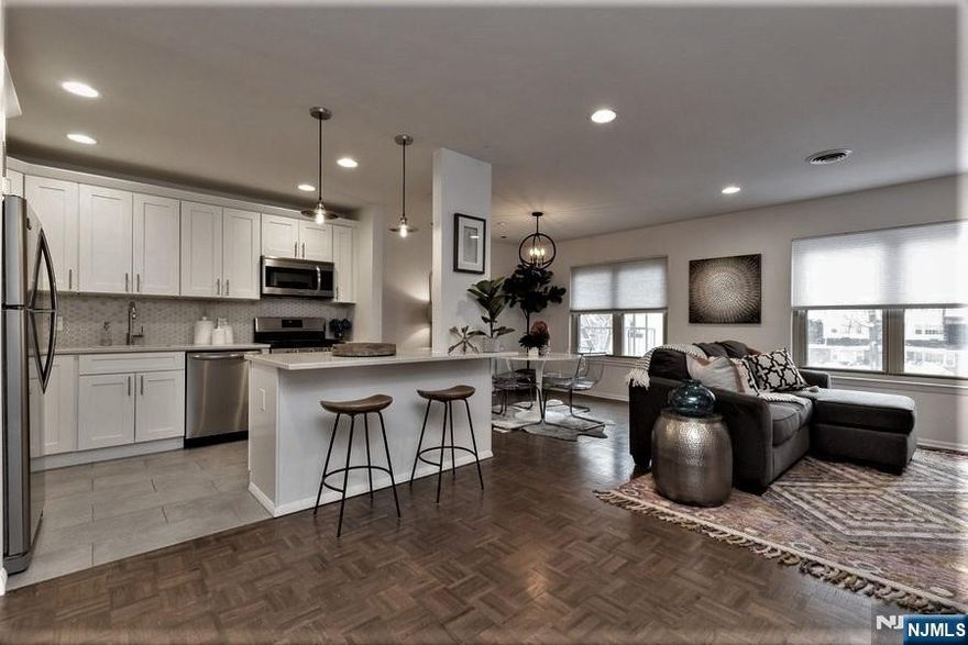 An unbeatable VALUE -hot/ cold WATER + HEAT + GAS +PARKING are all INCLUDED in the rental PRICE. So no additional suppressing bills, just electric. This private CONDO offers Central AC, Huge OPEN layout w/ sunken LR + DR+ Kitchen fabulously remodeled w/QUARTZ counters + center ISLAND w/seating & SS appliances. Master BR w/ REMODELED en-suite BATH, huge double CLOSETS, LR has perfect corner for home OFFICE desk /space. GARAGE avail for a fee. LOCATION, LOCATION ! Very near DOWNTOWN & NYC direct Bus, WHOLE Foods, ART Museum, WELLMONT Theater - LIVE concerts, Montclair film festival/CINEMA. BOUTIQUE stores & Boutique Ethnic, vegan, organic... RESTAURANTS w/ BYOB, yoga & SPA/ beauty centers. DIRECT- NYC train few blocks away.