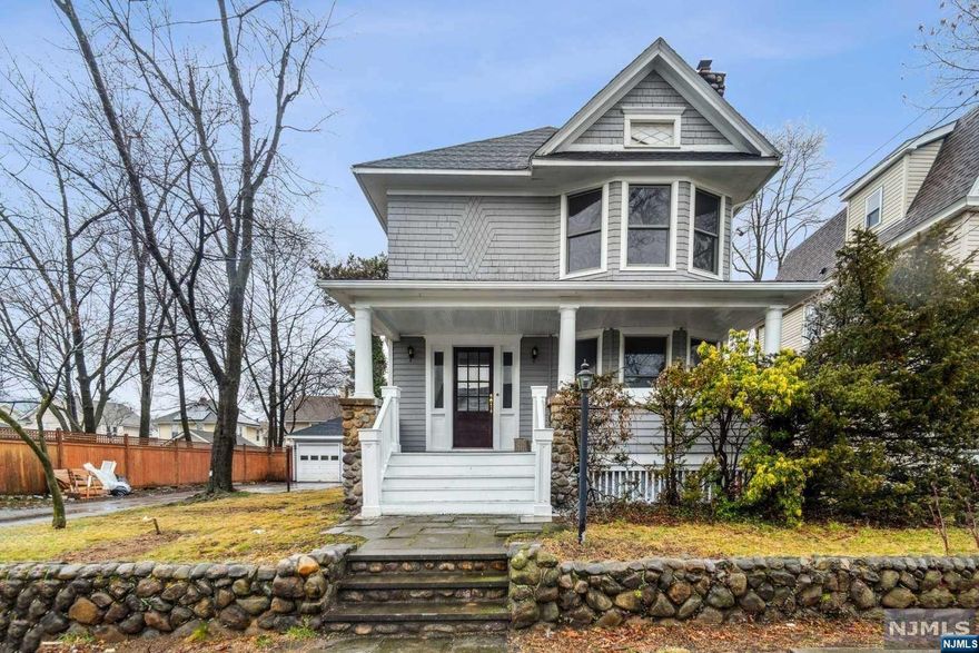 Welcome to this 3-bedroom, 1.5 bathroom colonial w/2-car garage in a quiet neighborhood and large sized lot. Inviting open front porch as entrance leads to foyer and living room with fireplace and charming stained-glass windows. Nice sized dining room, kitchen and half bath on first floor with mulltiple entrances to house from the deck in the back of the house. Second floor contains three bedroom and full updated bathroom with double sinks. Very large attic for storage and high ceilings in basement for additional space for workshop, storage, or to make into living space. New roof, boiler, and water heater. Make this your home.