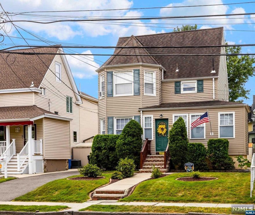 Lovely colonial home located within walking distance to NYC trains, buses, school, restaurants and shopping. This home offers three bedrooms, 2 1/2 baths, living room w/sliders to large deck great for entertaining and formal dining room and mud room. Basement is finished with media room, office area and laundry. Driveway and street parking. There is an outdoor connection for you to install a charger for an electric vehicle. Don't wait to make this your home.