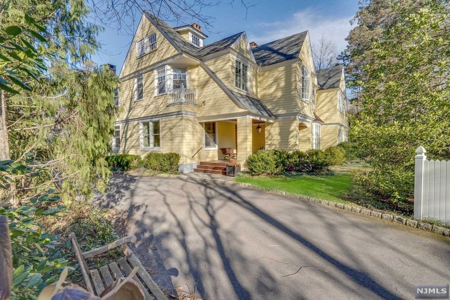 Stunning Private Gated Estate in prime location, on East Hill of Englewood. Just 8 miles from NYC, brings you to your beautifully landscaped enclave. The Mahogany porch leads to a Magnificent Center Hall Colonial. Attention to every detail is clear upon entry. Mouldings, hardwood floors, european tile with both formal and casual entertaining rooms. Natural light floods this home, with large windows and skylights throughout. 7 Bedrooms, and 6.1 bathrooms, and .9 of an acre, make this a home, where memories will be made. The kitchen and Butler's Pantry have luxury Viking appliances and hand painted enamel sinks. Family Room, is warm, inviting and filled with natural light. This home is meticulously maintained, and truly unique. Conveniently located being in walking distance to Houses of Worship,and Englewood's sophisticated town center. This a home not to be missed.