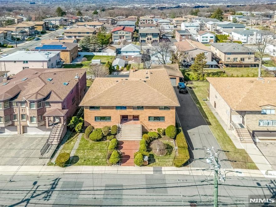 Welcome to 2413 Hammett Ave in Fort Lee, an exceptional side by side two family home that truly stands out from anything else on the market. Perfect for multi-generational living, investors, or owner-occupants seeking additional income, this unique property offers space, flexibility, and modern updates throughout. The larger residence features 5 spacious bedrooms and 4.5 beautifully updated bathrooms, designed with both comfort and functionality in mind. The smaller side offers 3 bedrooms and 2.5 bathrooms, providing an equally inviting and well appointed living space. Both units boast renovated kitchens and bathrooms, along with updated interiors that blend style and convenience. The fully finished basement adds incredible versatility, complete with a wet bar, summer kitchen, bonus room, and a separate side entrance ideal for entertaining, extended living, or additional recreational space. Step outside to your private backyard oasis featuring an in-ground heated pool, perfect for relaxing or hosting gatherings all summer long. Additional highlights include both an attached two car garage and a detached two car garage, offering ample parking and storage. Ideally located just minutes from NYC transportation, major highways, top rated schools, parks, and premier shopping, this is a rare opportunity to own a one of a kind multi-family home in the heart of Fort Lee. Donâ€™t miss your chance to experience the unmatched lifestyle and versatility this property has to offer.