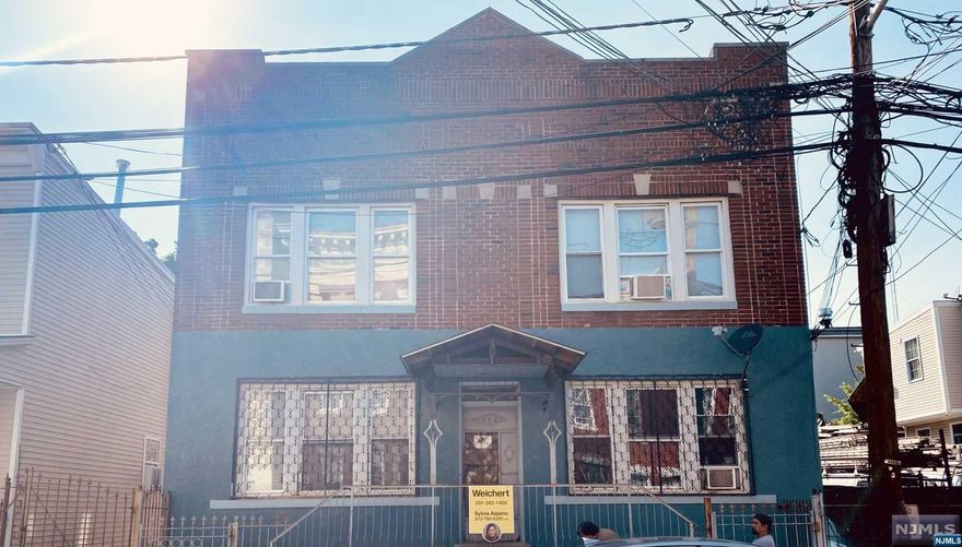 This fourplex is situated in the highly sought-after North Ward of Newark, offering convenient access to NYC public transportation, major highways, various places of worship, and schools. It presents an excellent opportunity for a savvy investor or owner-occupant with a vision and creative flair to turn it into a lucrative investment. The four identical units each feature two bedrooms, an eat-in kitchen, a family room, and one bathroom, providing the potential for an owner to live in one unit while renting out the other three. Additionally, the building has parking available in the rear accessible through a shared driveway, which can be designated for each tenant or rented out as an extra income source. The owner covers the heat and hot water expenses for all units. Tenants are all month-to-month and home will be sold with tenant's in place. This property will be sold "AS IS". No repairs or credits will be be made or given. Buyer is responsible for acquiring C/O and any city certs