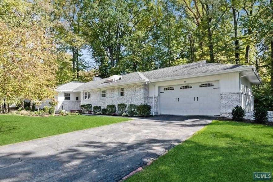 **OPEN HOUSE - BY APPOINTMENT ONLY ** Spacious sprawling Ranch set on a 1/3-acre landscaped property on quiet east hill street. Renovated, bright and sunny: Entry foyer leads onto large living room w/wood burning fireplace and full-size dining room. Picture windows and French door overlooking the back and opens to a large deck and patio for easy indoor/outdoor entertaining. Beautiful kitchen with granite countertop Bertazonni stove, stainless-steel appliances and breakfast area. Barn doors lead to a bright family room/den with access to the back. Sizable bedrooms with plenty of closet space and a spacious primary bedroom w/ensuite bath. Beautifully finished lower-level recreation room, laundry and storage/utility room. 2-car attached garage. 2-yrs A/C, duct & water heater. 8-yrs furnace; 10-yrs roof. New walkway, front planting and professionally painted outside. Great location, walk to elementary school & NYC bus. Owner has NJ RE License.
