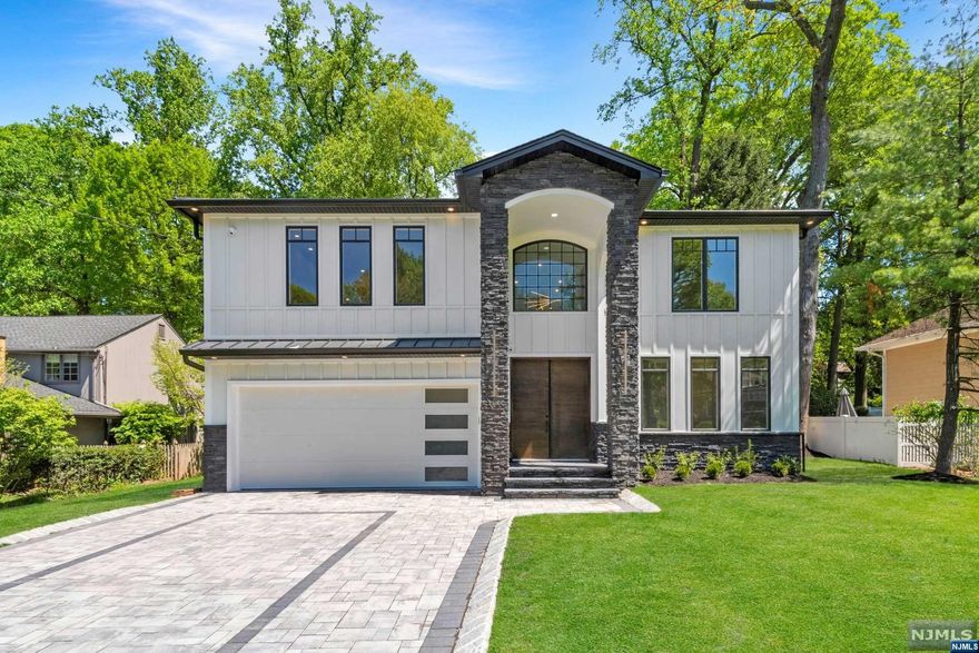 This modern masterpiece boasts 6 beds, 6 baths, and 4500 sq ft of luxury living space. The high level of quality and attention to detail is evident from the moment you enter. Built by a reputable local builder, the home features a solid foundation, offering flexibility with a 1st-floor bedroom suite. The chef's gourmet kitchen with top-of-the-line appliances is perfect for hosting dinner parties in the elegant dining room. Upstairs, the primary suite features custom closets and a large bath, accompanied by a junior suite, 3 beds, and a laundry room. With a home theatre, entertainment room, and full bath, this home is perfect for hosting loved ones. Featuring high reflex double insulation and a full house generator, this home offers comfort no matter the season. Located in the sought-after East Hill of Tenafly area just minutes from NYC, and with access to a superb school system.[Tax is not assessed yet and it is just an estimate]