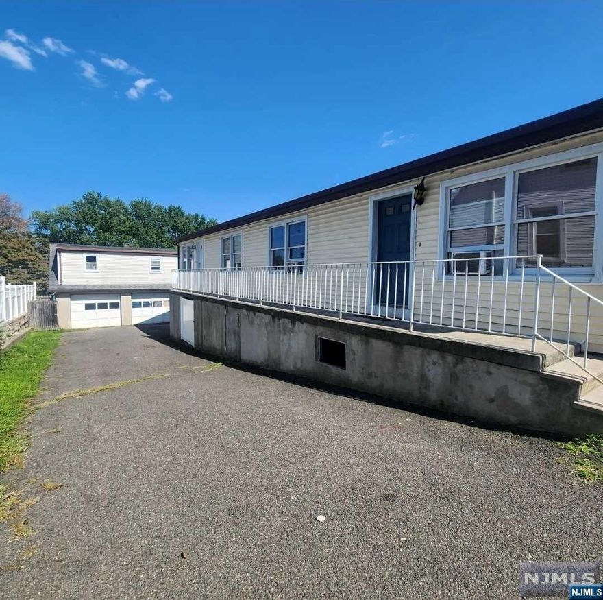 Welcome to this unique side-by-side two-family home featuring an oversized garage. Front unit: 2 bdrs, bath, living room, kitchen, Finished basement. Rear unit: 2 bdrs, bath, living room, kitchen, Partially finished walk-out basement with extra one room Each unit has its own gas, furnace, water heater, and electric panel. Two-car garage with a large attic for extra storage. Driveway accommodates 4-5 cars. This property offers convenience, privacy, and plenty of space for storage and parking.