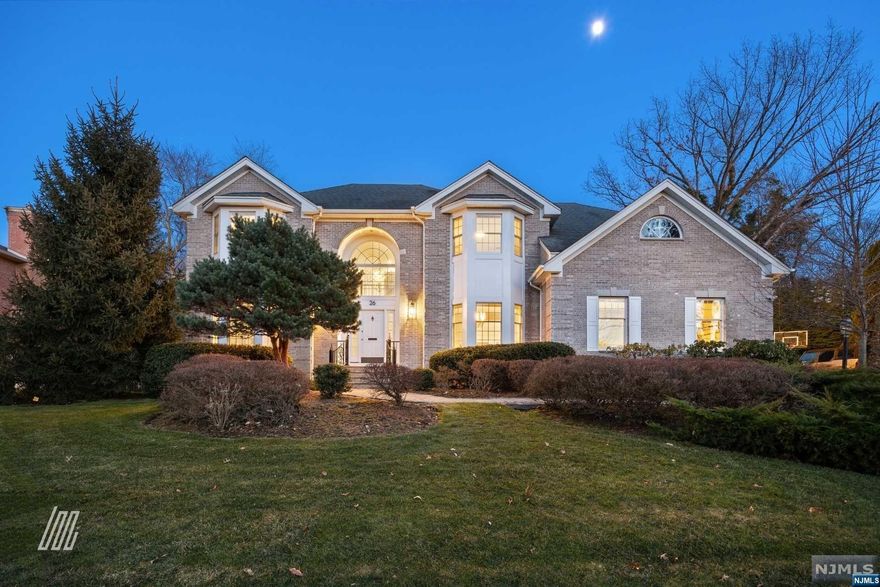 WATCH VIDEO (info@26arnoldave.com). Located in close proximity to Closter Plaza and Hillside elementary school, this 5BR/4.1BA residence was completely renovated in 2019 & mesmerizes with an elegant brick exterior, immaculate landscaping, and a paver driveway. Embracing luxe vibes at every turn, the chic interior features soaring foyer ceilings, an open floorplan, elegant formal dining room, cozy living room, and a great room w/fireplace. Find joy in cooking with a gourmet kitchen boasting premium stainless-steel appliances, quartz counters, custom cabinetry, center island, gas range, and double ovens. Envision relaxing in the upper-level primary suite, which has a sitting room, fireplace, tons of closet space, and a posh en suite. Four additional bedrooms delight with plenty of closet space, while one bedroom also enjoys an en suite. Entertain in the enormous finished basement, or cookout in the private backyard. Other features: 2-car garage, laundry area, rec room, and more