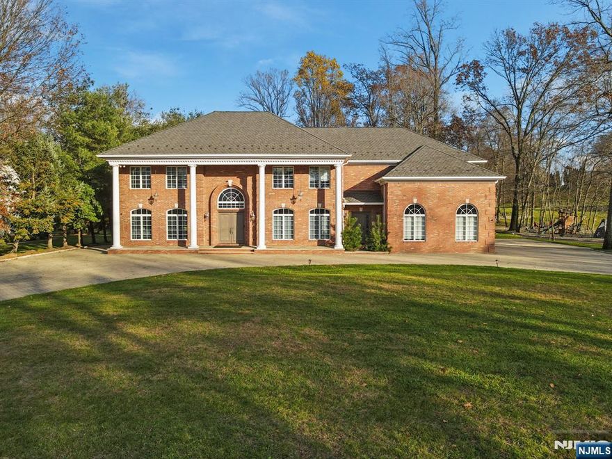Set on a beautifully landscaped acre with a stunning circular stone driveway and a level backyard overlooking serene reservoir sunsets, this fully renovated center hall colonial smart home is the epitome of timeless elegance and modern luxury. Located within walking distance of the prestigious Old Tappan Golf Course, the residence offers over 7,100 square feet of meticulously designed living space. Step through the grand two-story foyer into interiors that feature soaring ceilings, intricate moldings, and an effortless flow throughout. The main level is ideal for entertaining, with a formal dining room, private office, elegant living room, and a dramatic two-story great room anchored by a cozy fireplace. The gourmet kitchen is a chefâ€™s dream, equipped with top-of-the-line appliances, a charming breakfast nook, walk-in pantry, mudroom, and tranquil views of the lush backyard. A spacious bedroom and full bath complete the main floor. Upstairs, the luxurious primary suite offers a private retreat, complemented by four additional ensuite bedrooms. The third level includes a full bathroom, laundry room, and a flexible recreation space perfect for a home gym, studio, or playroom.