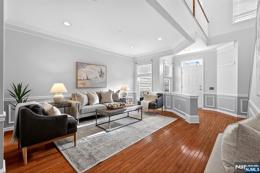 Welcome to this beautifully upgraded 3-bedroom, 3.5-bath townhouse with a 2-car garage, located in the prestigious 24-hour gated Hickory Hill community.This stunning residence has been thoughtfully renovated with high-end finishes throughout. The home features granite countertops, stainless steel appliances, gleaming hardwood floors, and a dual gas fireplace that adds both warmth and sophistication.The main level offers impressive 9-foot ceilings and hardwood flooring extending through both the first and second floors, creating a seamless and elegant flow. The second level includes two generously sized bedrooms, while the oversized primary suite serves as a true retreat, complete with a private sitting area and dedicated dressing space.The fully finished walk-out basement provides exceptional flexibility, featuring a third bedroom and a full bath ideal for guests, or a private home office. Step outside to a large private deck, perfect for relaxing or entertaining.Community amenities include:In-ground swimming pool, Clubhouse with gym and lounge.Ideally situated with NYC transportation directly in front of the complex and convenient access to major highways and nearby golf courses.Move-in ready this is truly a must-see home.