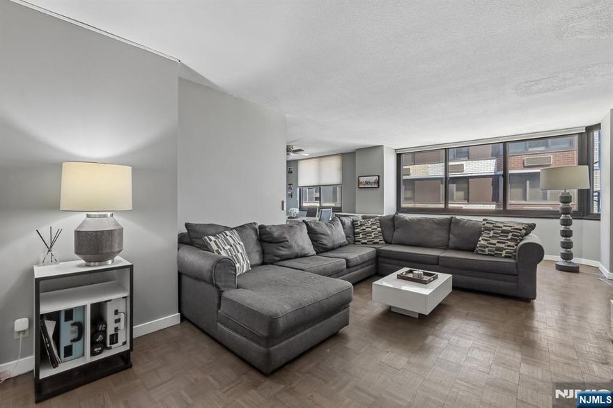 Welcome to this beautifully updated 1-bedroom, 1-bathroom high-rise condo offering modern comfort and effortless city living. The open-concept layout creates a bright and spacious feel. The bedroom features newly installed flooring, while the fully renovated bathroom comes along with its own separate temperature control for added comfort. Enjoy the convenience of automatic blinds, allowing you to easily adjust natural light and privacy at the touch of a button. Residents of this well-maintained building benefit from an array of amenities, including a 24/7 front desk concierge and security, a refreshing pool, a fully equipped exercise room, and on-site laundry facilities. Ideally located with close proximity to New York City and nearby hospitals, this condo offers the perfect balance of accessibility and comfort--making it an excellent choice for commuters, professionals, or anyone seeking a stylish, low-maintenance lifestyle.