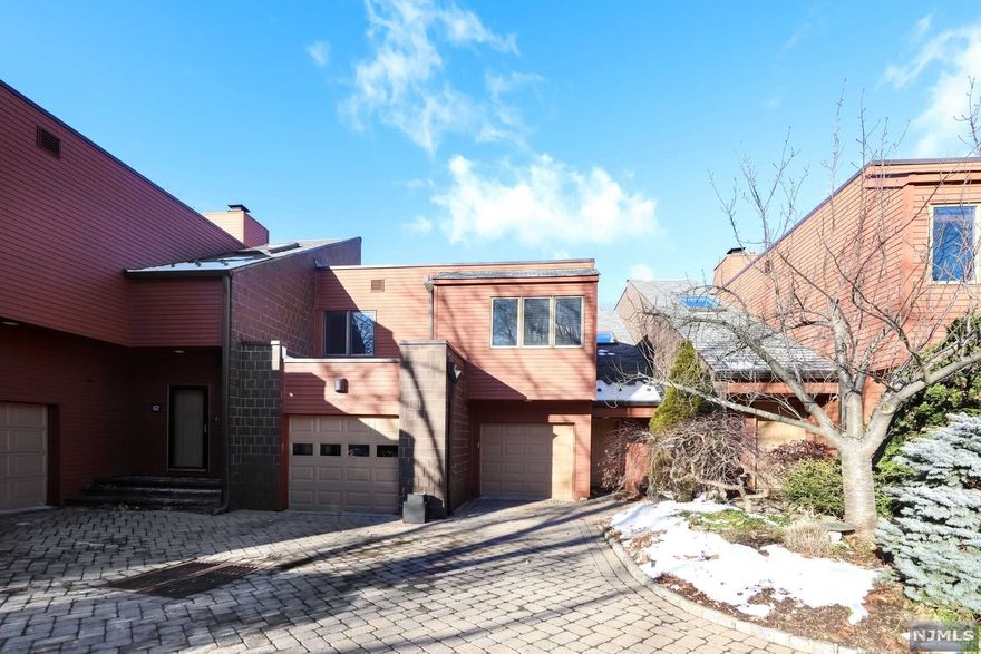 Welcome to your modern, spacious & complete home in the much desired Oak Trail community! This gorgeous home boasts 3762 square feet of living, hardwood floors, 2 working fireplaces and tasteful updates throughout. Enjoy your open concept living and dining area, with a new TREX deck terrace attached. A renovated Chef's kitchen complete with new countertops, cabinets and appliances. An expansive master bedroom suite with double vanities and a walk in closet. A ground floor sizable rec room that goes right onto a huge patio. 4 bedrooms, 3.5 bedrooms, attached 2 car garage, and a heated community swimming pool. Close to parks, nature trails, schools, shopping and mere miles from NYC.