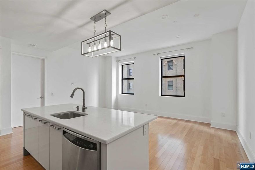 **Call Listing Agent at Keller Williams City Views Realty Office: 201-592-8900**Spacious two bedroom two bathroom condominium in one of Journal Square's most desired buildings. Features brand new a/c unit, new washer/dryer combo in-unit, recessed lighting in all rooms, updated kitchen including modern countertops and backsplash and NYC views with a ton of natural light throughout the day! Building amenities include 24 hour security, 24 hour Doorman, a Fitness Center, Pool, Game Room, Poker Room, Theater, Dog Run, Play Area, Shuttle to PATH and SO much more!