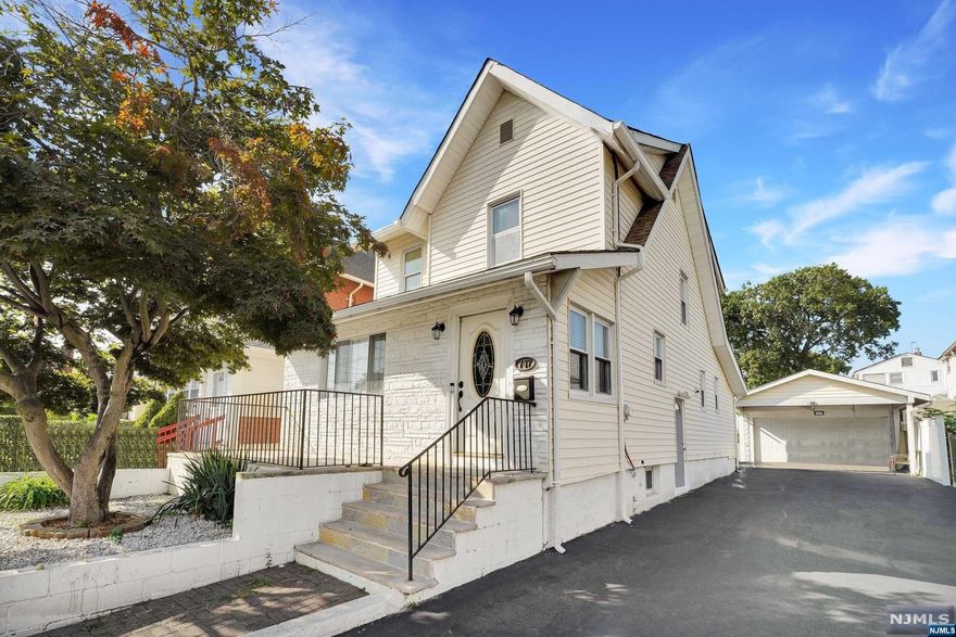 Welcome to 747 20th Ave, Paterson, NJ a charming, meticulously maintained two-story single-family home that's move-in ready. This property features an updated kitchen with modern appliances and ample storage, seamlessly connected to a spacious living room and dining area with beautiful hardwood floors. The first-floor master bedroom offers a private retreat with an ensuite full bath. Upstairs, there are three additional bedrooms and a full bath, perfect for family or guests. The finished basement provides extra living space with another bedroom and full bath ideal for a home office, gym, or guest suite. The exterior features a recently paved driveway, a two-car garage, and a private backyard with a patio, perfect for entertaining. Located near local amenities, schools, and public transportation, this home offers comfort and convenience. A must-see for those seeking a well-appointed, move-in-ready home in Paterson. Don't miss the chance to make this your new home!