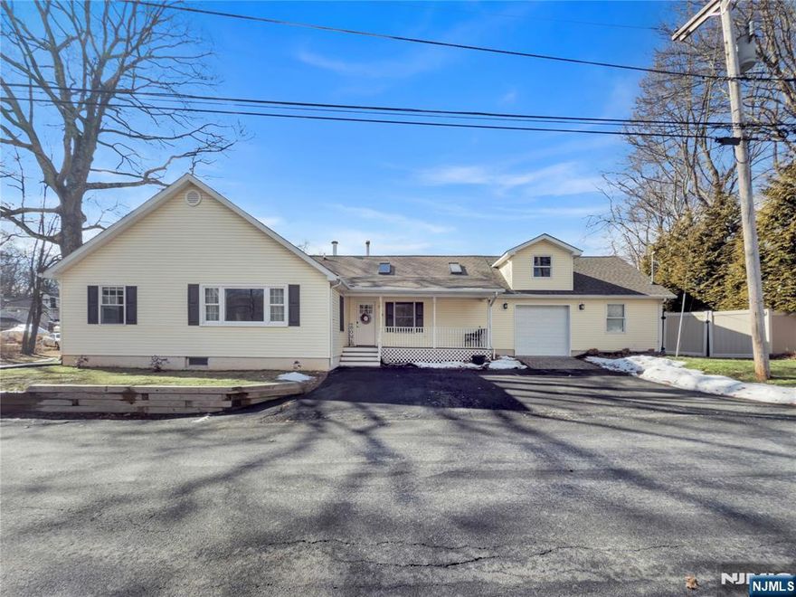 Experience comfort, convenience, and charm in this beautifully updated homeâ€”an excellent condo alternative. The inviting front porch welcomes you inside, where vaulted ceilings and gleaming hardwood floors create a bright, airy space. The updated kitchen features stylish LVF flooring that flows into the dining area, complete with a cozy wood-burning stove. The oversized one-car garage includes a workshop and loft for extra storageâ€”perfect for hobbyists. Enjoy a private, fenced backyard with a charming porch, new patio, shed, and garden. Minutes from Lake Hopatcong State Park, this home offers modern updates and prime outdoor living!