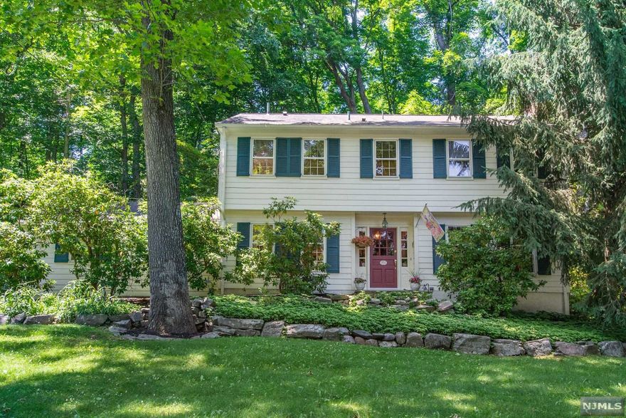 Welcome Home! Custom Colonial home with Warmth and Character throughout featuring 4 BRs, 2.1 BAs and 2 Car Garage situated on over 1 acre. This well-maintained home includes a beautiful entry foyer and spacious DR with stone floors, FR with WBFP and wide plank floors, Beautiful Custom EIK, pantry area, Mud Room with cabinetry and access to garage, Large LR with wall of windows and view of patios and gardens, MBR with Full BA and Walk in Closet. Plenty of space for entertaining, Private, and peaceful back yard with custom stone patios, raised gardens, enchanting walkways, beautiful mountain backdrop view and plenty of driveway parking. Walk up attic includes tons of storage, HWBB heating system, CAC, hwflrs, Natural light filled rooms, natural gas in street and much more! Minutes to schools, shopping, and easy access to highways.