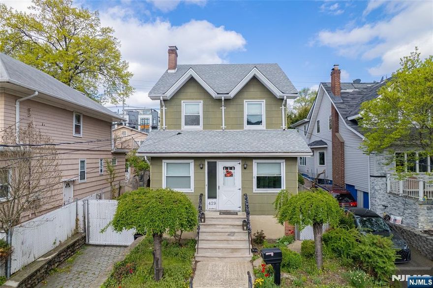 This beautiful 3-bedroom home in desirable Cliffside Park offers the perfect mix of modern updates and classic charm. The main floor features an enclosed porch, a living room with wood-burning fireplace, and a formal dining room that opens into a renovated kitchen with a center island. The second floor offers 3 good-size bedrooms and a renovated bathroom. The high-ceiling walk-out basement is ready to be finished for extra living space. Outside, you'll find a rare 3-car garage!!!! plus a driveway for 3 more cars. The deep backyard is an entertainer's dream, featuring a garden, a built-in pizza oven, and a large deck sitting right on top of the garages. Located within walking distance to NYC transportation and local shops, this home is a must-see. Schedule your showing today! Sunday April 26th -- Open House 1-3pm