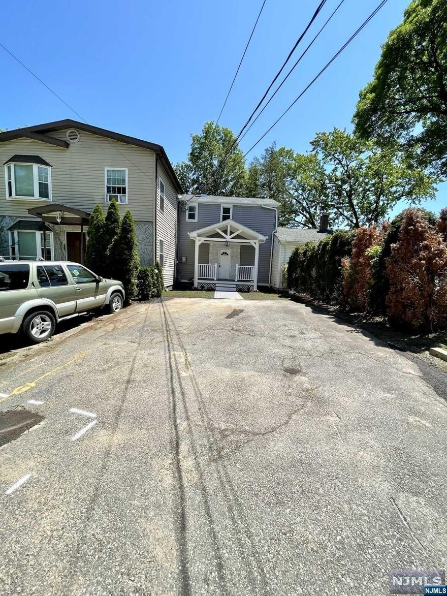 Prepare to be enchanted by this impeccably remodeled three bedroom Row House in the desirable Acquackanonk neighborhood. With its stunning upgrades, attractive features, and move-in-ready condition, this property is the epitome of modern living. This Row House offers a versatile layout, comprising one stand-alone bedroom and two charming railroad style bedrooms. Embrace the opportunity to create personalized spaces, whether you desire a home office, an additional bedroom, or a cozy reading nook, this home offers the flexibility to accommodate your needs. Indulge your culinary aspirations in the completely remodeled kitchen, boasting top-of-the-line stainless steel appliances, Elegant quartz countertop provides ample space for meal preparation. With new drywall, new electrical, and recessed lighting throughout the entire house, you'll experience a seamless blend of modern design and functionality. The new HVAC system, water heater, roof, siding, and plumbing ensure optimal comfort.