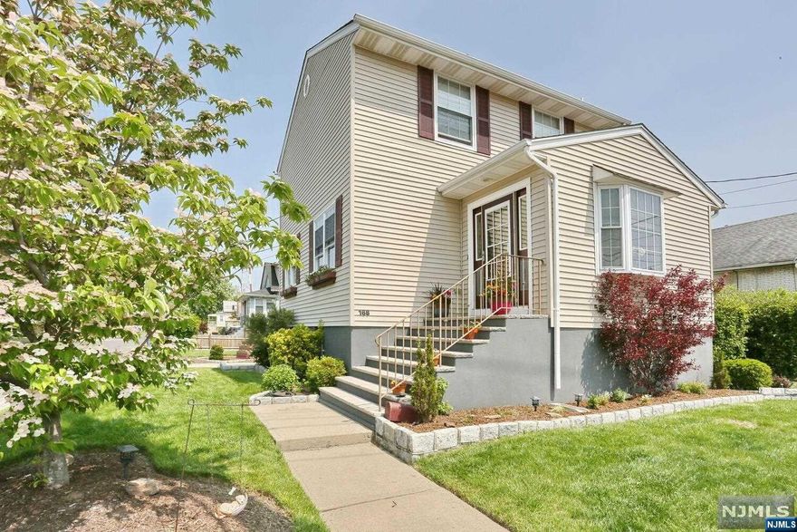 PERFECT EXTENDED FAMILY HOME! Nothing to do but move in to this legal single family home located in a 2 family zone. A beautiful colonial with tasteful updates & gorgeous crown moulding throughout; near to schools, NYC trans, parks & shopping! The entry foyer welcomes you in where you'll find a powder rm, large living rm w/bay window, updated EIK w/dining area, access to backyard as well the ground floor.The updated kitchen features a unique granite sink, a double oven & enough space for entertaining! The 2nd fl offers 3 BRs, plenty of closet space, a nicely updated full bath w/linen closet as well as attic storage!The ground FLR offers a separate entrance w/ mudroom, a large fam room, laundry area, a white kitchenette, full bath, & an oversized built in closet. Big ticket items that are already done for you are the hot water heater, windows, two zone heat to keep costs down during the winter months, c/a/c for summer comfort (both recently upgraded), gutter leaf guards.Don't miss!