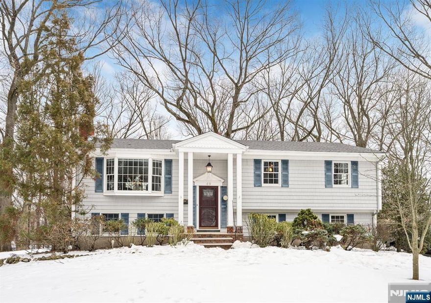 Beautiful, lovingly maintained, move-in condition family home located in a highly desirable section of Washington Township on a quiet cul-de-sac. This oversized property offers a peaceful setting with a walking path to a highly rated elementary school. The main level features an inviting entry foyer, a bright living and dining room combination, and updated eat-in kitchen with sliding glass doors leading to a spacious deck â€” ideal for entertaining or enjoying morning coffee. The primary bedroom includes a private half bath, along with two additional bedrooms and a full hall bathroom. Hardwood floors run throughout. The ground level provides additional living space with a cozy wood-burning fireplace, a laundry room with toilet and portable shower (convertible to a full bath), and access to a large private backyard â€” perfect for gatherings or relaxation. Additional highlights include a long driveway, a two-car garage, and proximity to parks, shopping, and major highways including the Garden State Parkway. A fantastic opportunity for buyers looking to settle in a great neighborhood and create their forever home. Call Inna at 201-873-8551