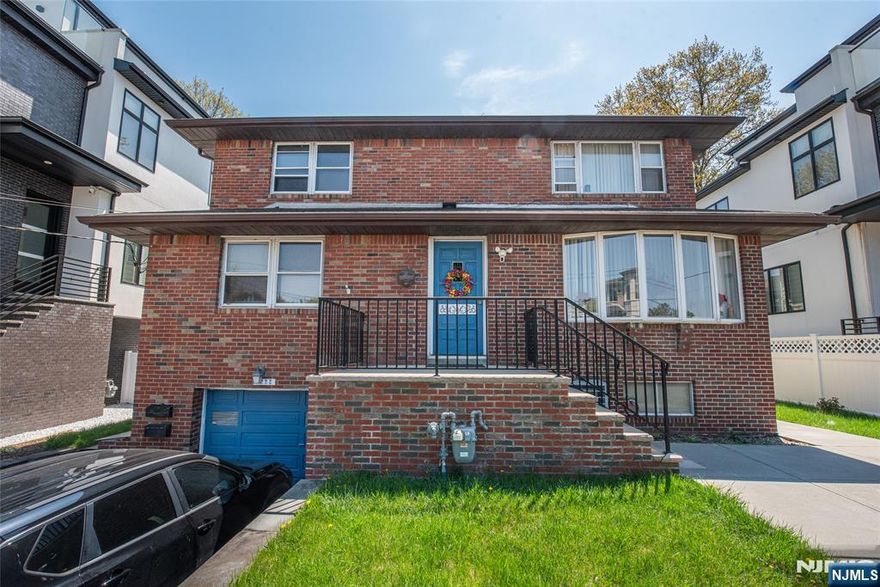 Whether you are an investor or an owner occupant, this is the home you have been searching for. Offering over 3,000 sq. ft. of living space, this property delivers immediate income potential & long-term upside for investors, developers, & owner-occupants alike. Minutes from the George Washington Bridge, this home provides a streamlined NYC commute in an area recognized for strong & reliable rental demand. The 1st floor unit features 3 spacious Bedrooms with ample closet space, open concept Living Room, Dining Room, Eat-in Kitchen, & a Full Bath. With direct access to the lower level, this space naturally lends itself to expanded or extended living. The lower level features a full bath, summer kitchen, spacious recreation room, utility room, and direct access to an oversized attached garage with additional storage and a laundry area, accessible to both units. The 2nd floor unit offers an expansive Living Room flowing into a Modern Eat-in Kitchen, followed by a Full Bath & 2 generously sized Bedrooms. Step outside into the fully fenced backyard, offering a private outdoor setting ideal for entertaining, relaxing, or everyday enjoyment. Additional features include separate utilities, outdoor storage, & ample parking. Close proximity to top schools, parks, shopping, public transportation, major highways & EZ access to NYC.